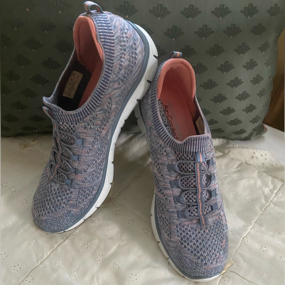Skechers Slip-on Air-Cooled Memory Foam knit sneaker. Knit upper, rubber sole.